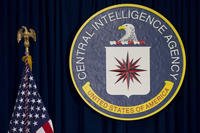 The seal of the Central Intelligence Agency stands next to a U.S. flag at CIA headquarters in Langley, Va.