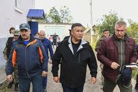 Tver region governor Igor Rudenya, center, arrives to attend a meeting of the operational headquarters in Toropets