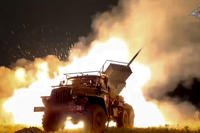 Russian Army &quot;Grad&quot; self-propelled 122 mm multiple rocket launcher fires rockets toward the Ukrainian position