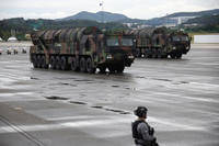 The Hyunmoo, surface-to-surface missile, march during a celebration