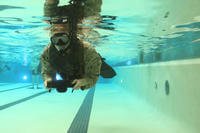 A Marine conducts a 500-meter underwater swim with fins and a snorkel at the Courthouse Bay Training Tank aboard Marine Corps Base Camp Lejeune, N.C.