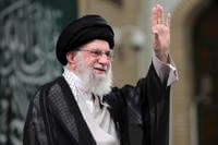 Iran's Supreme Leader Ayatollah Ali Khamenei waves to the crowd.