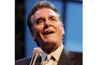 Chuck Woolery hosts a special premiere of the '$250,000 Game Show Spectacular' at the Las Vegas Hilton Saturday, Oct. 13, 2007, in Las Vegas. (Ronda Churchill/Las Vegas Review-Journal via AP, File)