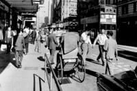 Double-decker street cars are shown in Hong Kong's Des Voeux Road on Nov. 13, 1964.