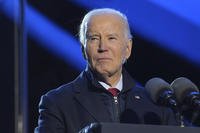 President Joe Biden speaks during a ceremony lighting the National Christmas Tree on the Ellipse