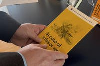 Swedish Civil Contingencies Agency expert holds a crisis preparedness brochure.