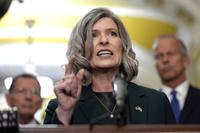 Sen. Joni Ernst, R-Iowa, talks after a policy luncheon on Capitol Hill