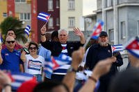 Cuba's President Miguel Diaz-Canel, middle, greets supporters