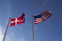 U.S. and Danish flags fly