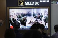 A TV screen at Seoul Railway Station in South Korea, on Oct. 21, 2024, shows an image of soldiers believed to be from North Korea standing in line to receive supplies from Russia.