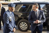 Defense Secretary Pete Hegseth looks toward Gen. Charles Q. Brown