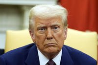 President Donald Trump listens