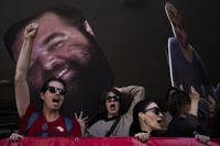 Demonstrators hold photos depicting the faces of Israeli hostages who are being held in the Gaza Strip