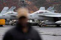 U.S. F-18 Super Hornet fighter jets are seen on the flight deck of the Nimitz-class nuclear-powered aircraft carrier USS Carl Vinson at a port in Busan