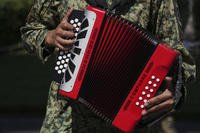 A soldier plays an accordion at a military base in Mexico City