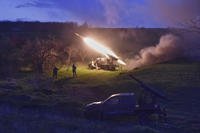Ukrainian servicemen fire a multiple launch rocket system