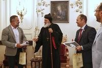 U.S. congressmen Cory Mills (R-FL), left, and Martin Stutzman (R-IN), second from right, meet Mor Ignatius Aphrem II
