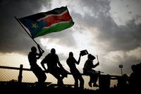 Southern Sudanese wave the national flag in the capital Juba