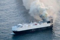 smoke rises from cargo vessel Morning Midas approximately 300 miles south of Adak, Alaska