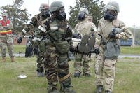 Airmen with the 157th Air Refueling Wing, New Hampshire Air National Guard, perform a litter carry as part of a multi-day military readiness exercise at Pease Air National Guard Base, Newington, N.H..