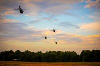 Arkansas National Guardsmen deploy to Texas on July 8, 2025, to assist with the transportation of search and rescue personnel in the vicinity of Austin, Texas, during catastrophic flooding.