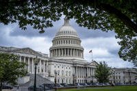 The Capitol is seen under dark skies in Washington