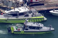 Miami-Dade Fire Rescue and others in boats around what appears to be a barge involved in an accident