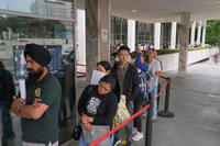 People line up outside the Los Angeles Federal Building in Los Angeles