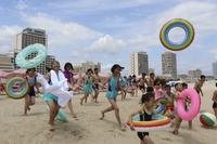 Children run into sea at the Wonsan-Kalma resort in Wonsan, Kangwon Province, North Korea