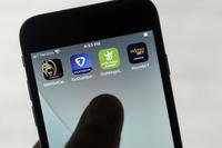 Online gambling apps are displayed on a phone in San Francisco