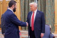 President Donald Trump, right, shakes hands with Syria's interim President Ahmad al-Sharaa