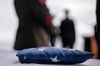 A folded American flag, flown aboard the amphibious assault ship USS Boxer