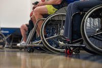 Athletes line the court as they are instructed on wheelchair basketball during Warrior Games training at Colorado Springs