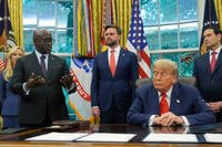 President Donald Trump listens as Rwanda's Foreign Minister Olivier Nduhungirehe speaks during an event