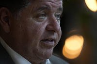 Illinois Gov. J.B. Pritzker sits for an interview with the Associated Press