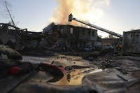Rescue workers put out a fire at a building destroyed during a Russian strike in Zaporizhzhia, Ukraine.