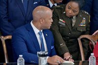 Maryland Gov. Wes Moore speaks with Maj. Gen. Janeen Birkhead, adjutant general of the Maryland National Guard, at a bill signing in the Governor’s Reception Room.