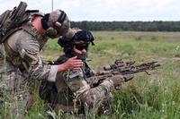U.S. Army Staff Sgt. Bruno Rios, a sniper with Charlie Troop, 2nd Battalion, 106th Cavalry Regiment, Illinois Army National Guard, confirms that the weapon of his Polish counterpart is clear following the completion of a shooting drill at a range near Toruń, Poland, June 7, 2025.