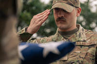 U.S. Air Force Senior Airman Judah Rice, a honor guardsman assigned to the 628th Air Base Wing, gives a facing movement command during military honors simulation for an active-duty funeral, Joint Base Charleston, South Carolina.