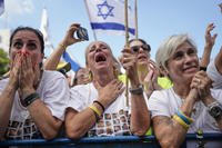 People react as they gather to watch a live broadcast of Israeli hostages released from Gaza at a plaza known as hostages square in Tel Aviv, Israel