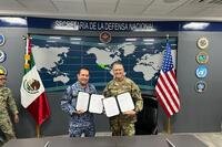 U.S. Army Maj. Gen. Matthew P. Beevers and Maj. Gen. Javier Sandoval Duenas, Deputy Chief of Military Doctrine of the National Defense Joint Headquarters Staff (EMCDN) sign a letter of intent formalizing the agreement for Mexico to join the State Partnership Program with the California National Guard. (U. S. Army National Guard photo by Capt. Jonathan Beck)