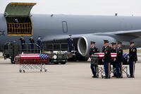 The remains of Staff Sgt. Edgar Brian Torres-Tovar and Staff Sgt. William Nathaniel Howard are moved during a dignified transfer at the Des Moines International Airport.