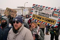 People protest near a post office in Minneapolis.