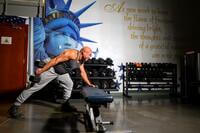 An airman performs a tricep extension.