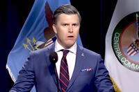 Colin Jost dressed as Defense Secretary Pete Hegseth speaks at a mock press briefing during a Saturday Night Live sketch. Credit: NBCUniversal / Saturday Night Live