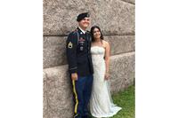This photo provided by Jen Rickling shows U.S. Army staff sergeant, Matthew Blank, left, and his wife, Annie Ramos, posing for a photo while celebrating their wedding, in March, 2026, in Houston. (Jen Rickling via AP)