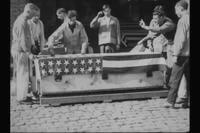 Army officers with a casket.