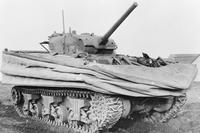 Sherman DD (Duplex Drive) amphibious tank with waterproof float screens. When in the water the float screen was raised and the rear propellers came into operation. 1944 (Photo: Imperial War Museums)