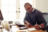 Man writing on a notepad