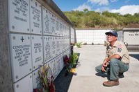 Chris Farley, U.S. Navy veteran and National Memorial Cemetery of the Pacific caretaker, reads the names of fallen service members at the cemetery in Honolulu.  (U.S. Air Force/Staff Sgt. Christopher Hubenthal)